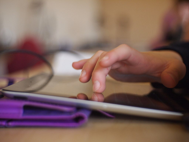 kids handling iPad